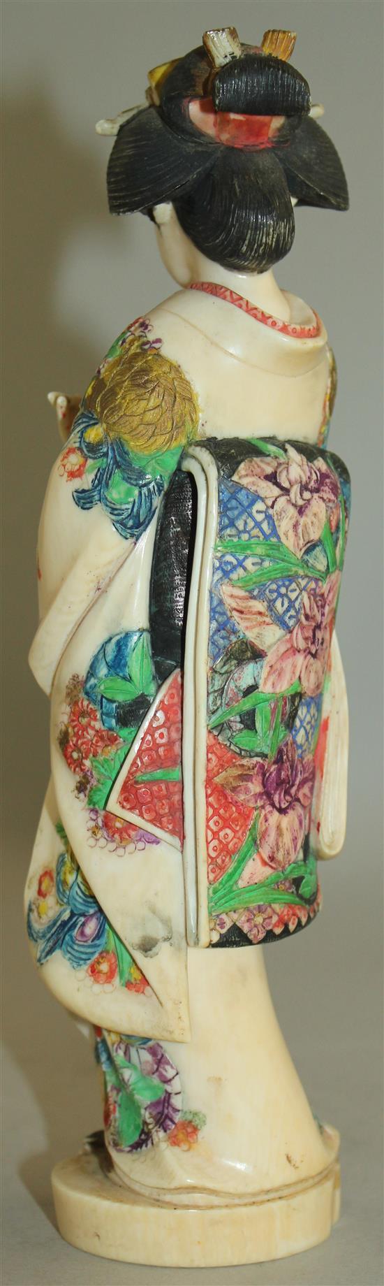 A Japanese coloured ivory figure of a bijin, early 20th century, 21cm